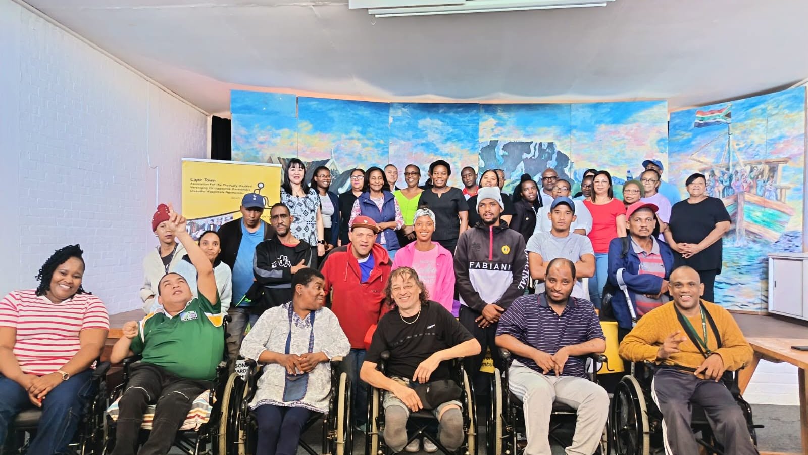 A large group of Cape Town APD members and staff together, several using wheelchairs